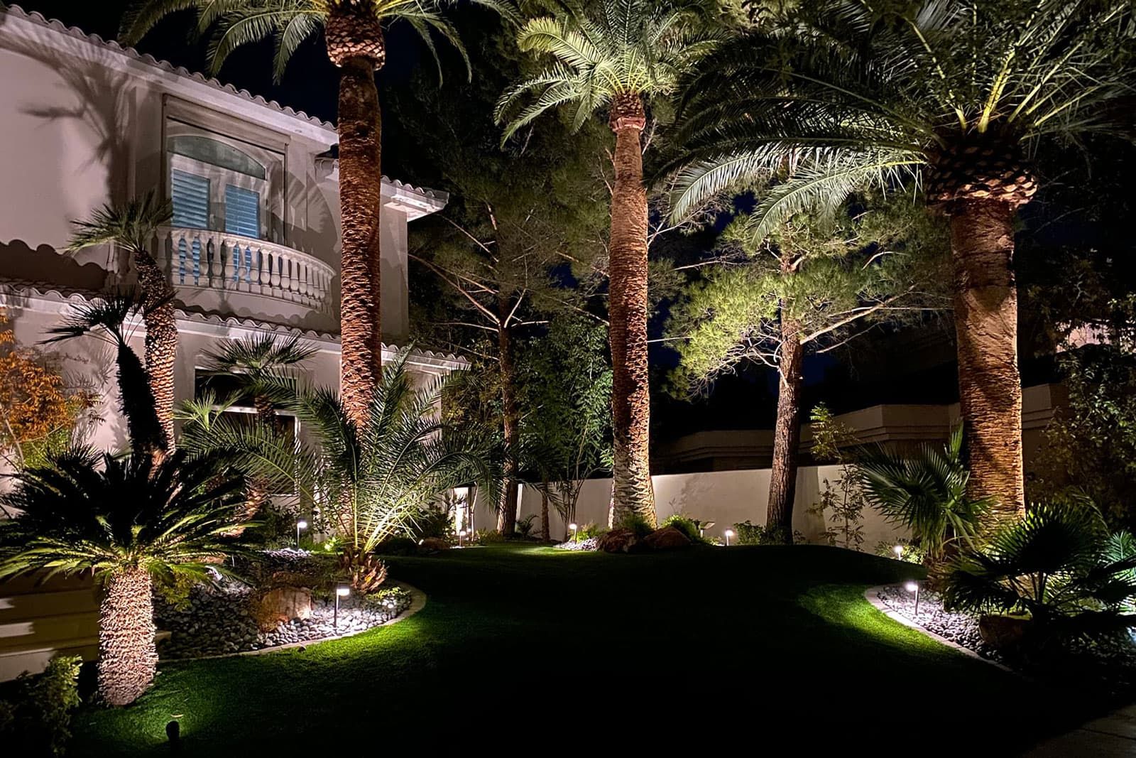 A Las Vegas Home With Professional Landscaping, Including Tree Service, Artificial Turf And Outdoor Lighting.