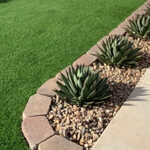 Residential Landscaping With Plants And Artificial Grass