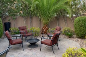 Patio Seating Area Surrounded By Desert Landscaping.